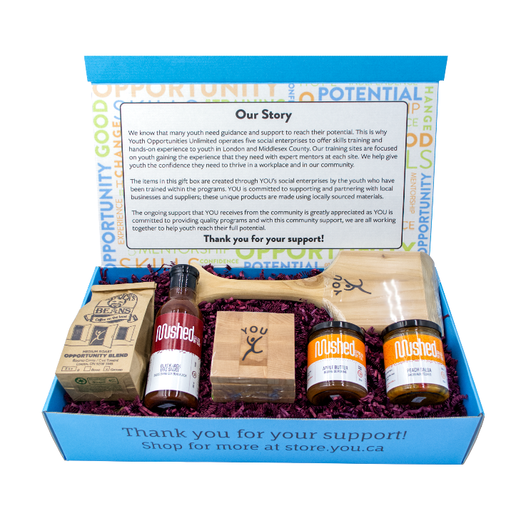 The lovely blue gift box features a printout of Our Story and our thanks for you, in additiona to the medium roast coffee, cedar BBQ Scraper, YOU branded coasters and 3 jars of Mushed by YOU preserves.