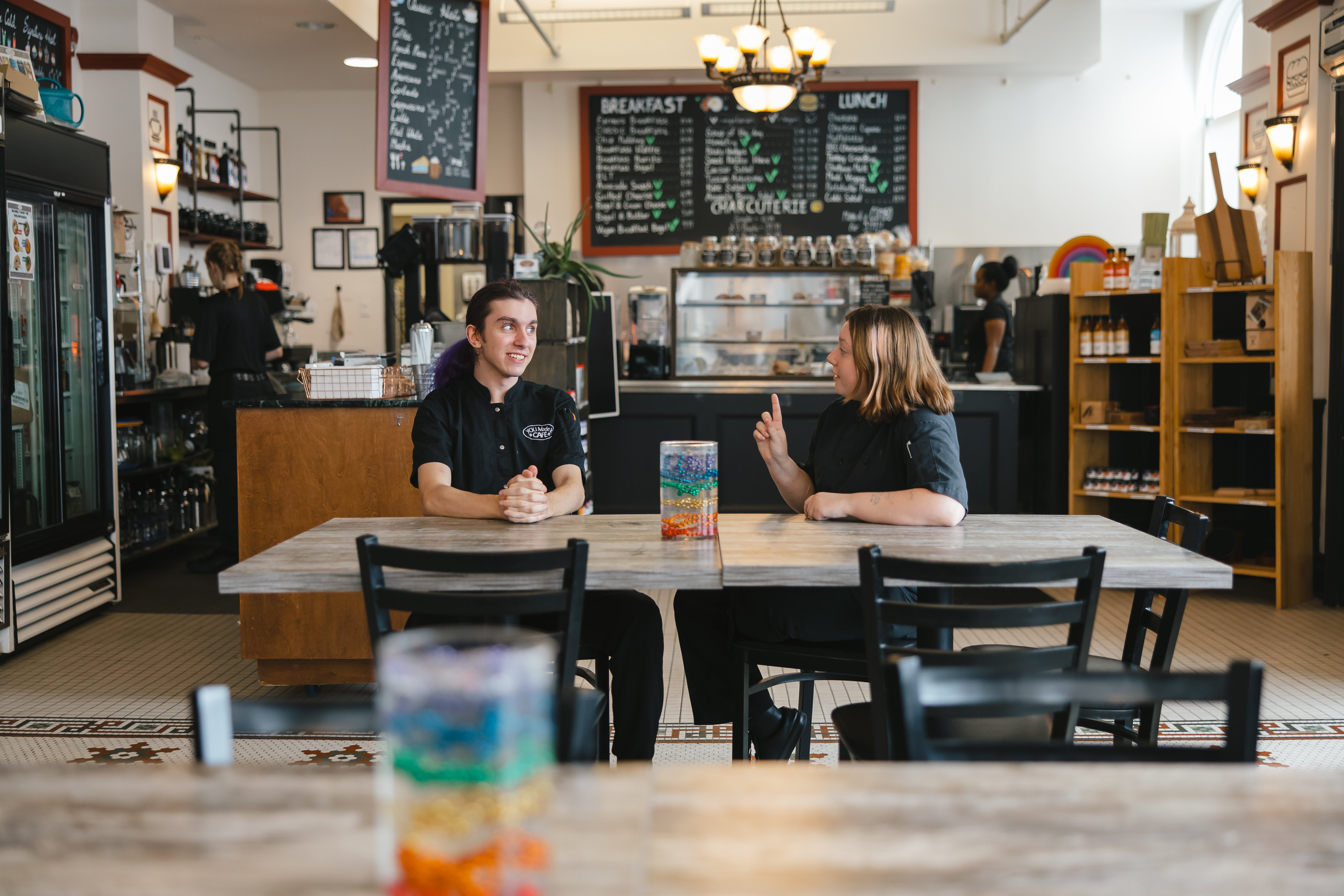 Two young people sitting in the cafe.